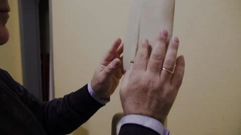 Hands of blind man touching a copy of a Cycladic statute Stock Footage 140986338