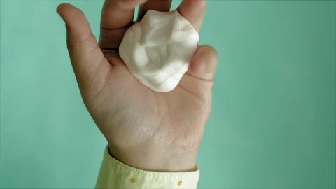 Hands on a blue background use multi-colored soft clay for modeling. Creative Stock-Footage 111245658