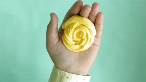 Hands on a blue background use multi-colored soft clay for modeling. Creative Stock-Footage 111246300
