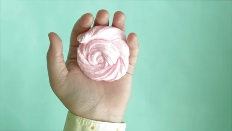 Hands on a blue background use multi-colored soft clay for modeling. Creative Stock-Footage 111246399