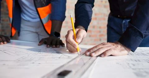 Hands, blueprint and drawing at construction site for engineer, teamwork or.. Stock Photos
