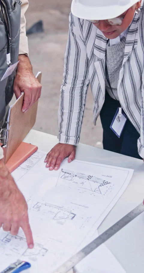 Hands, blueprint and planning with team for construction method, development or Stock Footage 340948712