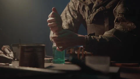 Hands of a Bomb Maker in the Warehouse making a bomb Stock-Footage 256037581