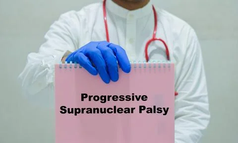 Hands a book with the name of the progressive supranuclear palsy. Stock-Fotos