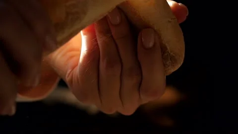 Hands break a bread baguette. Close-up. Slow motion Stock Footage 162553755