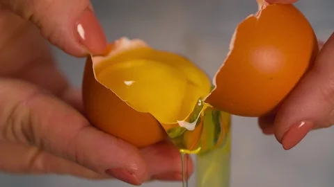 Hands break egg Extremely Close up Macro shot Stock Footage 103041269