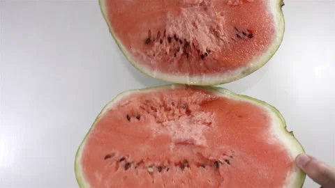 Hands break a watermelon into two halves in 4K Video stock 139356478