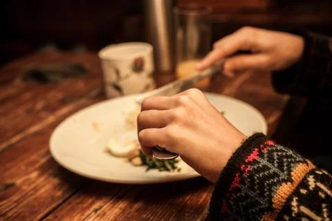 Hands at breakfast table Stock Photos