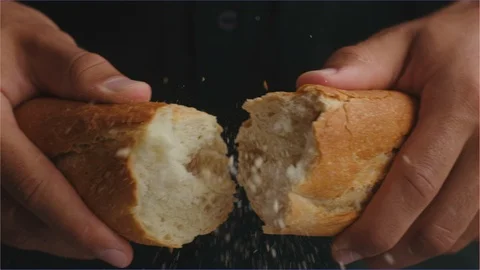 Hands breaking a bread roll in slow motion Stock Footage 107130161