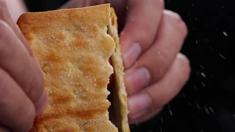 Hands breaking cracker with sugar in slow motion Stock-Footage 133174395
