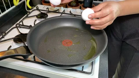 Hands breaking eggs Stock Footage 134133421