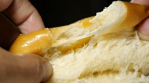 Hands breaking homemade bread in slow motion, close-up Stock-Footage 115141694