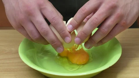 Hands Breaking One Egg With Two Yolks. Slow Motion.4K Stock Footage 283010071