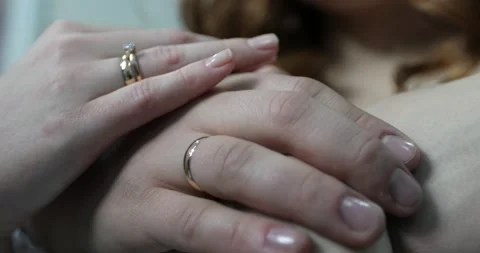 Hands of the bride and groom with wedding rings close-up. Stock Footage 166889664