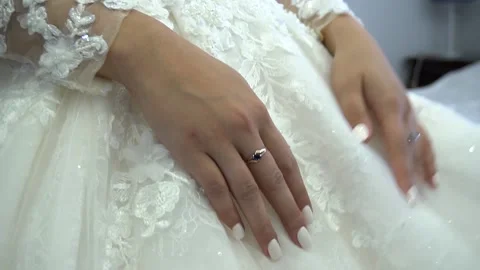 Hands of the bride gently stroking the clothes dress Stock Footage 150449045