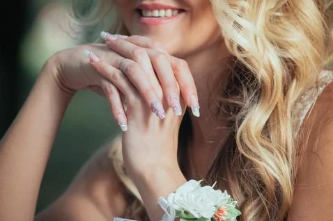 Hands of a bride with a nice manicure Stock Photos