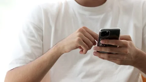 Hands browsing or shopping with mobile phone Stock Footage 254013664