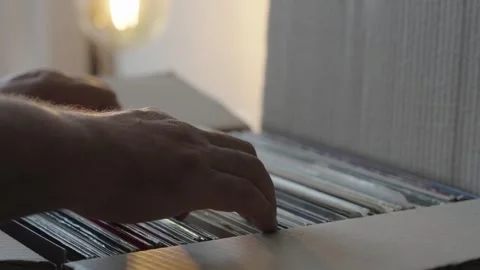 Hands Browsing Vinyl Record Collection in Cardboard Box Stock Footage 344971456