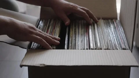 Hands Browsing Vinyl Record Collection in Cardboard Box Stock Footage 344971497