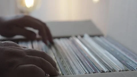 Hands Browsing Vinyl Record Collection in Cardboard Box Stock Footage 344971744