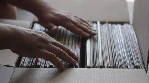 Hands Browsing Vinyl Record Collection in Cardboard Box Stock Footage 344971769