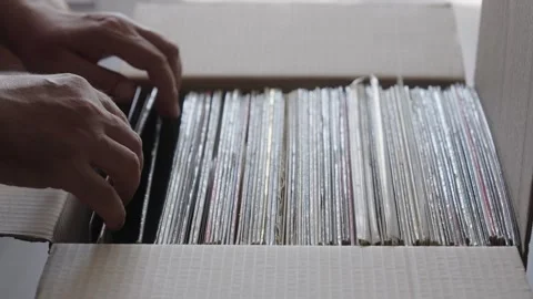 Hands Browsing Vinyl Record Collection in Cardboard Box Stock Footage 344972325