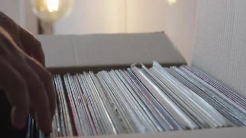 Hands Browsing Vinyl Record Collection in Cardboard Box Stock Footage 344972676