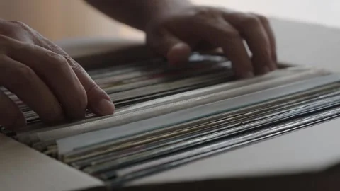 Hands Browsing Vinyl Record Collection in Cardboard Box Stock Footage 344972853