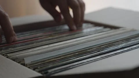Hands Browsing Vinyl Record Collection in Cardboard Box Stock Footage 344973243