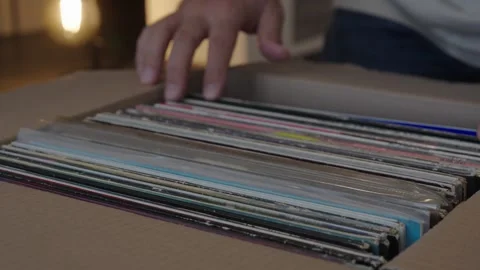 Hands Browsing Vinyl Record Collection in Cardboard Box Stock Footage 344973276