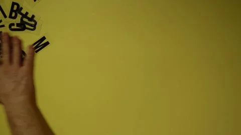 Hands brush the letters off the table Stock Footage 150361669