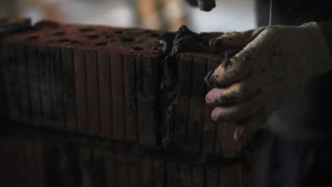 Hands of builder laying brick wall Stock Footage 276668468