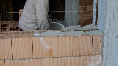 Hands Of The Builder Put A Cement Mortar. Hand Makes The Masonry Of Brick. Vídeo Stock 97633686