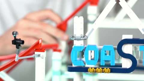 Hands building Lego Roller Coaster blocks Stock Footage 140483014