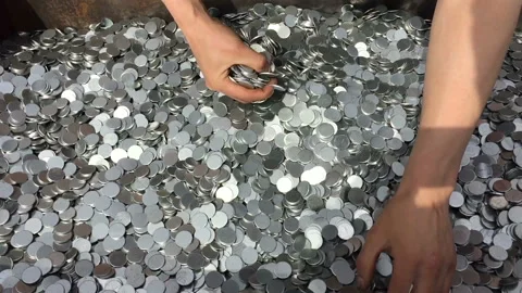 In the hands of a bunch of silver coins Stock-Footage 90512652