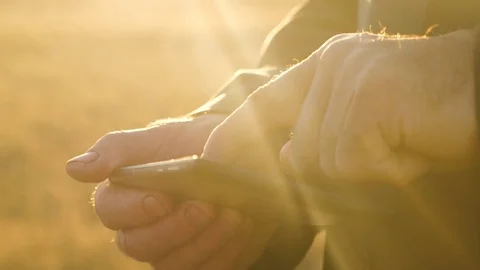 Hands of business man working with tablet in bright rays of the sun. close-up Video stock 97727199