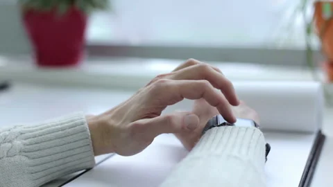 Hands of a businessman checking an incoming notification on a smart watch. Stock Footage 156240229
