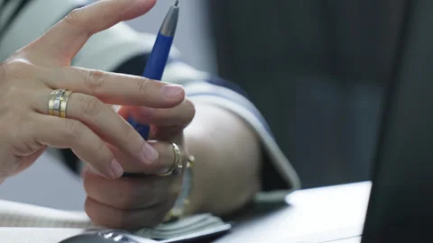 Hands of an businessman in expensive clothes work at computers in the office. Stock Footage 333472027