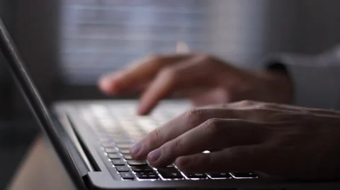 Hands of businessman working on computer by night Video stock 59912338