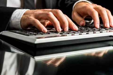 Hands of a businessman working on computer by typewriting on the keyboard, .. 写真素材