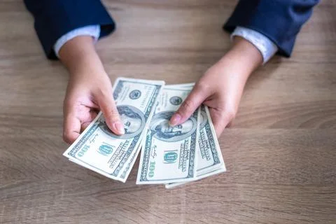 Hands of Businessmen counting us dollar bills ,  Business concept Stock Photos