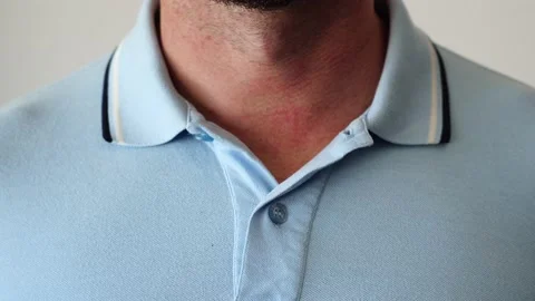 Hands buttoning a polo shirt not completely. Stock-Footage 205076063