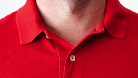 Hands buttoning a polo shirt not completely. Stock Footage 205076069