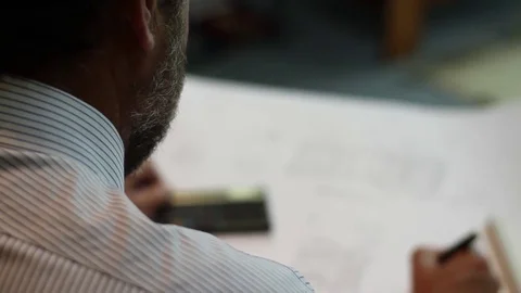 Hands calculating and writing Stock Footage 77046687