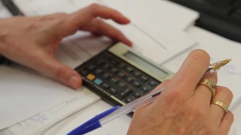 Hands on calculator Stock Footage 77046764