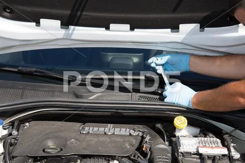 Hands of car mechanic in auto repair service. Stock Photos