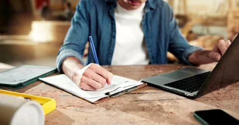 Hands, carpenter and laptop at workshop with clipboard, research and pricing Stock Photos