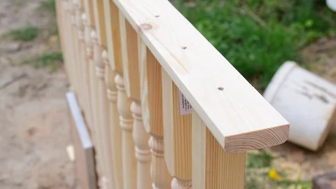 Hands of carpenter drilling holes with a drill in a balustrade Video stock 88343607