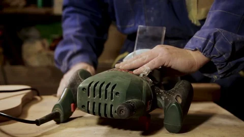 Hands of a Carpenter, prepare milling machine to work Stock Footage 100824173