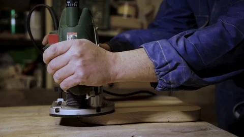 Hands of a Carpenter, work of a milling machine  Stock Footage 100833622